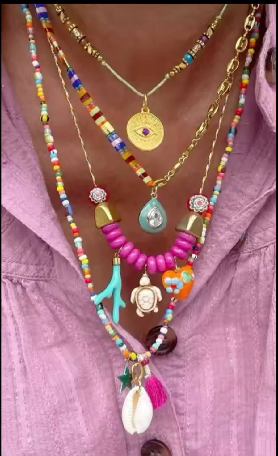 Aurina Pop UP Ltd Summer Necklace Stack featuring colorful beads and charms on a model's neck