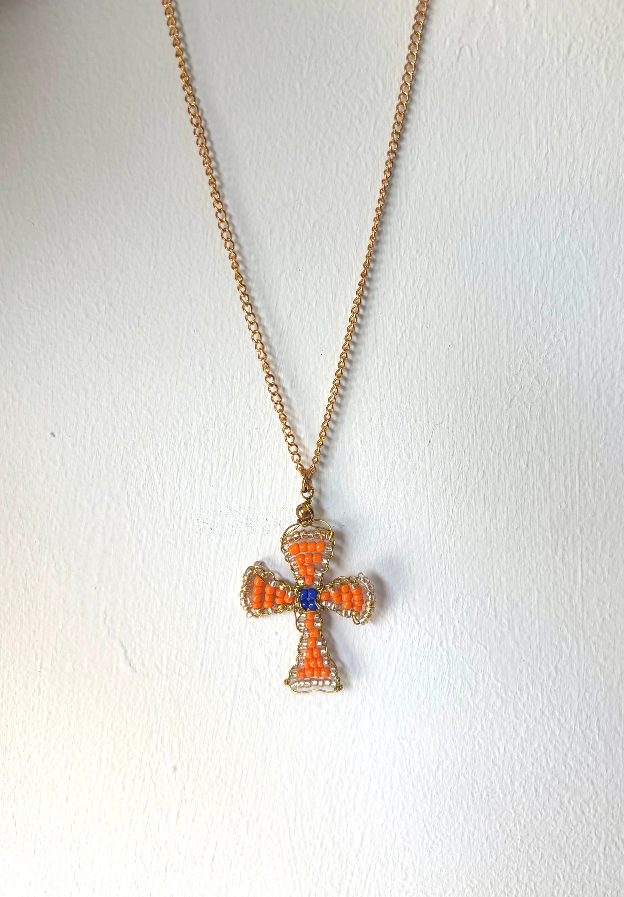 Hand beaded orange and cobalt cross necklace