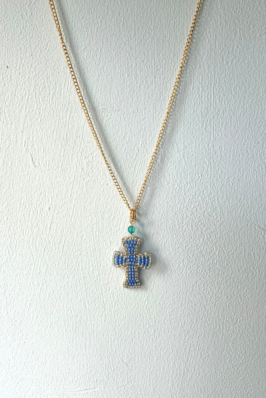 Hand beaded periwinkle cross necklace